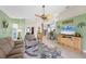 Bright and open floor plan with living room flowing into dining area and kitchen at 4225 Fairway Dr, North Port, FL 34287