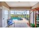 Covered patio area featuring nice views, an indoor/outdoor feel and a comfortable seating area at 4225 Fairway Dr, North Port, FL 34287