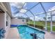 Screened in pool area with lush green views; relax and enjoy the outdoors in this peaceful setting at 4225 Fairway Dr, North Port, FL 34287