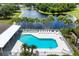 Aerial view of a community pool area surrounded by mature palm trees, providing a tropical oasis at 4225 Fairway Dr, North Port, FL 34287