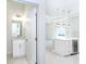 The half bathroom is accessible from the kitchen with a modern sink and granite counters at 482 Sunset N Rd, Rotonda West, FL 33947