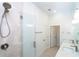 Modern bathroom with glass enclosed shower, double sink vanity and tile flooring at 482 Sunset N Rd, Rotonda West, FL 33947