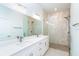 Beautiful bathroom featuring dual sinks, modern fixtures, and a glass enclosed shower at 482 Sunset N Rd, Rotonda West, FL 33947