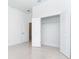 A bright and airy bedroom with tile flooring, neutral walls, and closet at 482 Sunset N Rd, Rotonda West, FL 33947