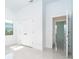 Bright bedroom with tile flooring, a large window, a spacious closet, and neutral walls at 482 Sunset N Rd, Rotonda West, FL 33947