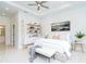 Stylishly decorated bedroom with neutral tones, tray ceiling, and contemporary furnishings at 482 Sunset N Rd, Rotonda West, FL 33947