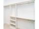 Walk-in closet with white organizers offering ample storage space and shelving at 482 Sunset N Rd, Rotonda West, FL 33947