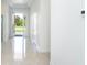 Clean foyer featuring tile flooring, neutral walls, bright light, and front door at 482 Sunset N Rd, Rotonda West, FL 33947