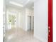 Bright and airy foyer featuring sleek tile flooring, neutral walls, and recessed lighting at 482 Sunset N Rd, Rotonda West, FL 33947