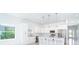Modern kitchen featuring white cabinetry, stainless steel appliances, and an island at 482 Sunset N Rd, Rotonda West, FL 33947