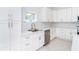 Updated kitchen featuring stainless appliances, modern fixtures and white cabinetry at 482 Sunset N Rd, Rotonda West, FL 33947