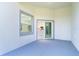 Covered patio with a view into the kitchen through the sliding glass door at 482 Sunset N Rd, Rotonda West, FL 33947