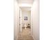 Bathroom featuring neutral tile flooring, a toilet, and a decorative plant at 5009 Skyview Ln, Bradenton, FL 34211