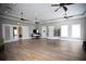 Spacious gathering area with ceiling fans, tables, and chairs perfect for community events at 5009 Skyview Ln, Bradenton, FL 34211