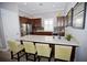 Community kitchen with breakfast bar, dark wood cabinets, and stainless steel appliances at 5009 Skyview Ln, Bradenton, FL 34211