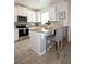 Well-appointed kitchen featuring stainless steel appliances, granite countertops, and stylish bar stool seating at 5009 Skyview Ln, Bradenton, FL 34211