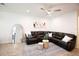 Cozy living room with a large sectional, area rug, and modern decor at 5009 Skyview Ln, Bradenton, FL 34211