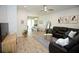 Cozy living room with modern decor and ample seating, transitioning seamlessly to the dining area at 5009 Skyview Ln, Bradenton, FL 34211