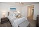 Comfortable primary bedroom with ceiling fan, soft lighting, and neutral decor at 5009 Skyview Ln, Bradenton, FL 34211