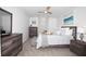 Cozy bedroom with a ceiling fan, light-colored walls, and comfortable furnishings at 5009 Skyview Ln, Bradenton, FL 34211