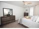 Bright, airy bedroom featuring a ceiling fan, modern furnishings, and soothing wall decor at 5009 Skyview Ln, Bradenton, FL 34211