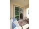 Relaxing patio with comfortable seating and sliding glass doors leading to the kitchen at 5009 Skyview Ln, Bradenton, FL 34211