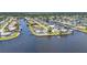 Aerial view of waterfront homes in a canal community, each with a private boat dock at 5174 Conner Ter, Port Charlotte, FL 33981
