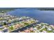 Community aerial view of waterfront homes on canal with boat docks and access to open water at 5174 Conner Ter, Port Charlotte, FL 33981