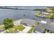 Waterfront home featuring a metal roof, dock, and serene water views at 5174 Conner Ter, Port Charlotte, FL 33981