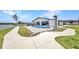 Backyard featuring a pool, patio, and waterfront access, perfect for outdoor enjoyment at 5174 Conner Ter, Port Charlotte, FL 33981
