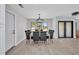 Light-filled dining area features new floors, modern lighting, and seating for eight at 5174 Conner Ter, Port Charlotte, FL 33981
