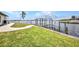 Gorgeous waterfront home features a private dock with boat lift and lush tropical landscaping at 5174 Conner Ter, Port Charlotte, FL 33981