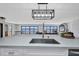 Gorgeous island with seating, modern lighting, and open floor plan at 5174 Conner Ter, Port Charlotte, FL 33981