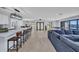 Spacious living room with modern open floor plan, tile floors, and waterfront view at 5174 Conner Ter, Port Charlotte, FL 33981
