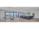 Spacious living room with scenic waterfront views and access to an outdoor patio at 5174 Conner Ter, Port Charlotte, FL 33981