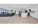 Bright, open-concept living space with a kitchen island and ample natural light at 5174 Conner Ter, Port Charlotte, FL 33981