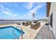 Stunning patio with pool and plenty of outdoor seating overlooking the beautiful waterfront at 5174 Conner Ter, Port Charlotte, FL 33981
