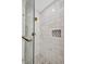 This modern bathroom features gorgeous marble tile and herringbone floor tile at 5174 Conner Ter, Port Charlotte, FL 33981