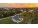 Breathtaking aerial perspective of a residence by the water at sunset at 530 Spaniards Rd, Placida, FL 33946