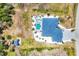 Aerial view of the home, pool, shed, and landscaping at 530 Spaniards Rd, Placida, FL 33946