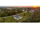Beautiful aerial view of a modern home with a pool, surrounded by lush greenery and serene landscapes at 530 Spaniards Rd, Placida, FL 33946