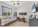 Cozy bedroom featuring a work space, natural light, and tile flooring at 530 Spaniards Rd, Placida, FL 33946