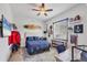Bedroom with nautical themed decor, lots of sunlight and a ceiling fan at 530 Spaniards Rd, Placida, FL 33946