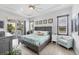 Well-lit bedroom with tray ceilings, slider door and coastal decor at 530 Spaniards Rd, Placida, FL 33946