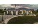 Beautiful single-story home featuring manicured lawn, three-car garage, and charming landscaping at 530 Spaniards Rd, Placida, FL 33946