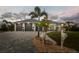 Beautiful single-story home with a three-car garage and front yard landscaping at 530 Spaniards Rd, Placida, FL 33946