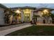 Charming home entrance with vibrant turquoise doors and lush tropical landscaping at 530 Spaniards Rd, Placida, FL 33946