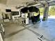 Spacious garage featuring a car lift and ample storage space at 530 Spaniards Rd, Placida, FL 33946
