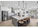 Bright, modern kitchen features a large island with seating and stainless steel appliances at 530 Spaniards Rd, Placida, FL 33946