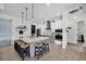 Modern kitchen with large island, stylish pendant lighting, and stainless-steel appliances at 530 Spaniards Rd, Placida, FL 33946